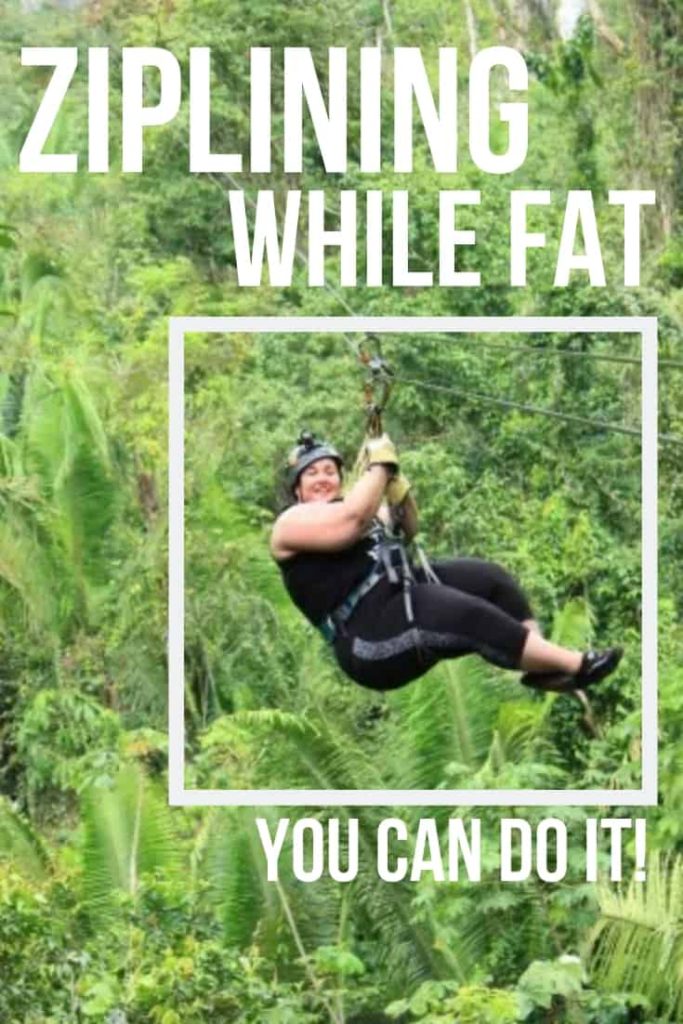 A fat girl ziplining through the bright green forest trees in Belize